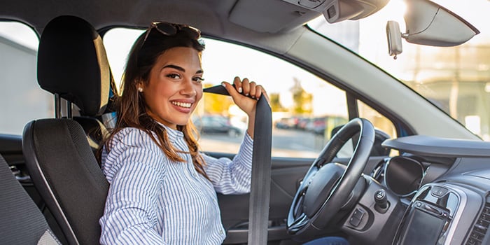 Woman enjoying her new vehicle